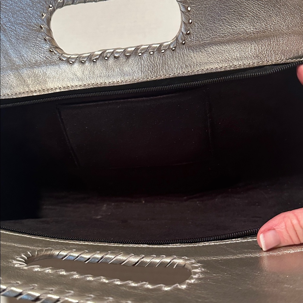 Metallic gray stamped leather handbag.  EUC.  15” wide 9.5” tall.  Zip closure. - Picture 2 of 3